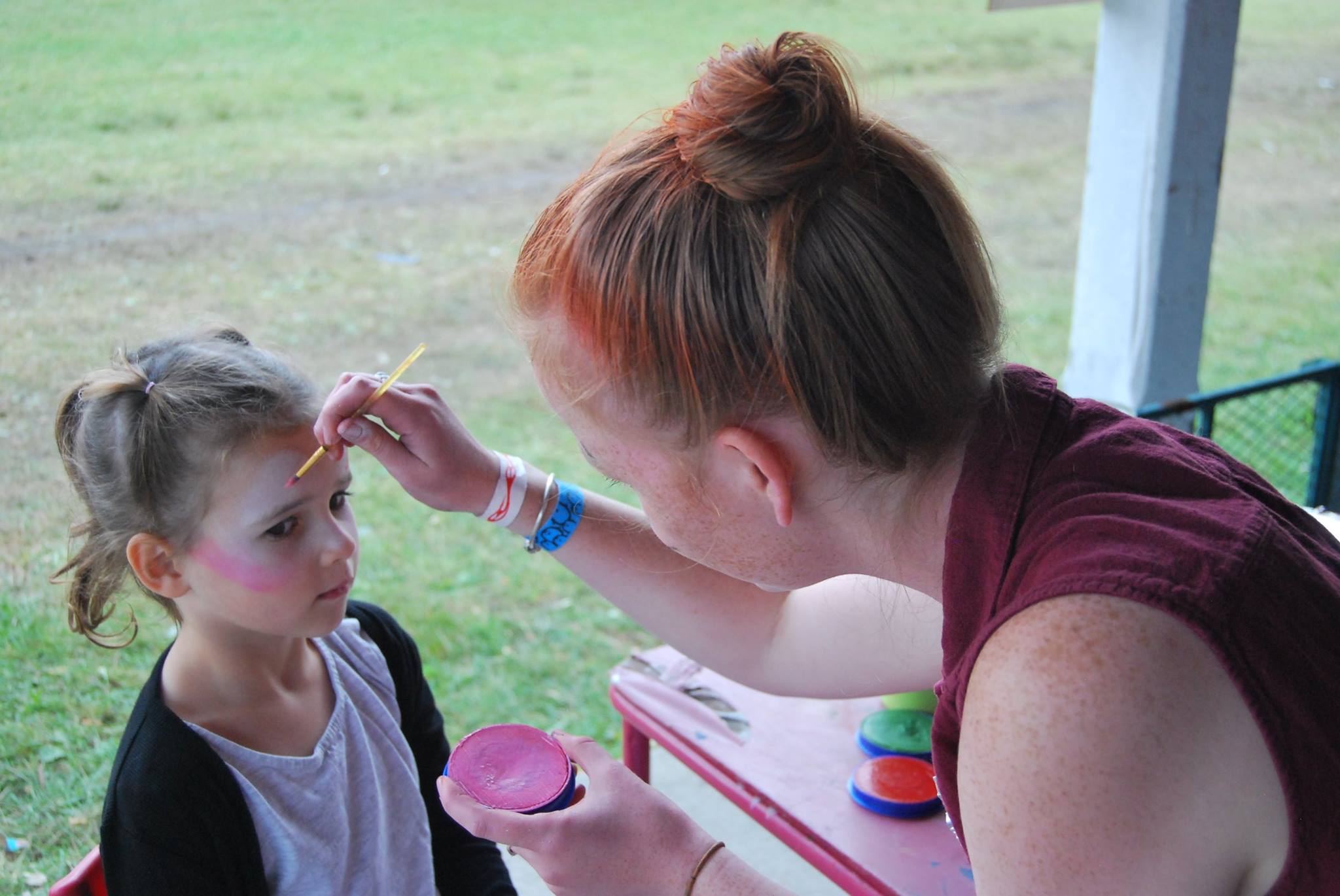 Young girl getting her face painted at the Stormont County Fair