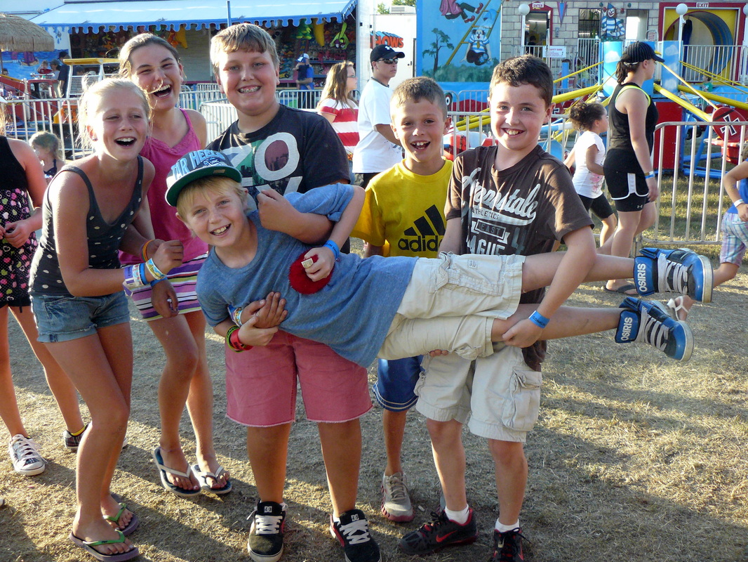 kids playing having fun at the fair